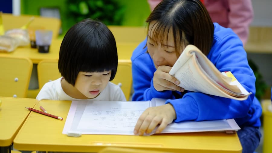 An ABA therapist working one-on-one with a child during a session